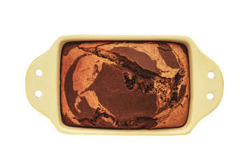Pie with strips of cocoa in the form for baking on a yellow background, top view, close-up, vegan