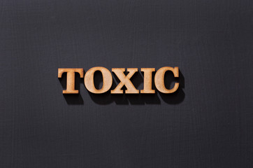 Toxic word in wooden letters - Top view