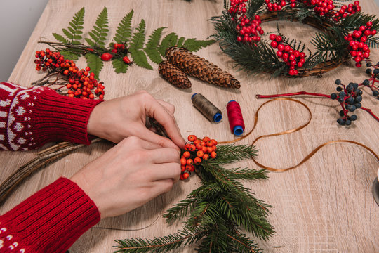 hands on wooden table with christmas decoration
