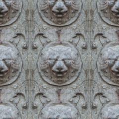 Fototapeta na wymiar Seamless photo texture of antique stone lion head from broken castle wall