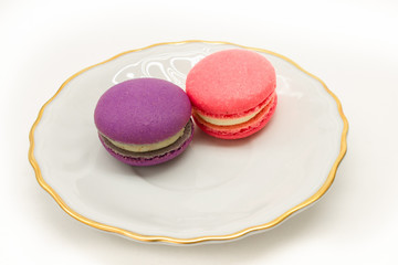 Macarons on a plate. White background
