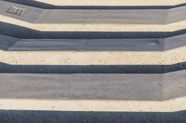 Fototapeta premium Stack of concrete railway sleepers in color image.