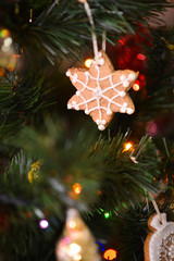 Christmas decor close-up, New Year's interior details, Christmas tree, balls on the branches, toys, candles, sock