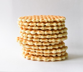 A stack round waffles isolated over white background.