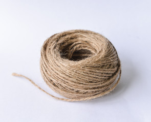 Skein jute twine ball of yarn lies on a white background. isolant