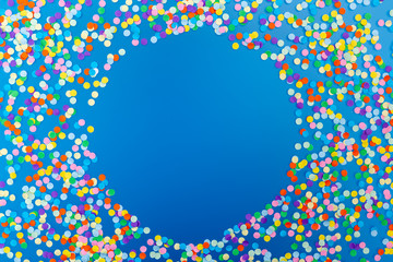 Round frame of colorful confetti on blue background. - obrazy, fototapety, plakaty