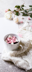 Creative winter natural composition with flowers, a cup of hot chocolate and marshmallows, with decoration pink color Flat lay Greeting card copy space.Christmas background Festive Drink concept.