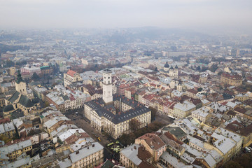 Aerial: City Hall of Lviv, Ukraine, misty weather