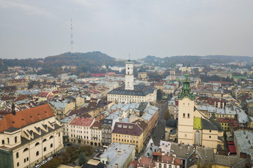Fototapeta na wymiar Aerial: City Hall of Lviv, Ukraine, misty weather