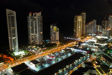 Fototapeta na wymiar Night aerial photo Sunny Isles Beach Florida luxury highrise towers