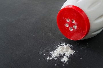 Cleaner scattered on a black wooden table.