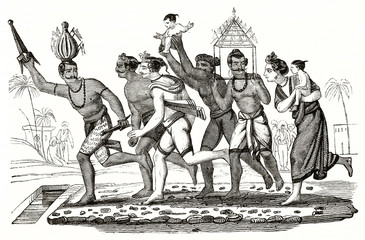 ncient indian indigenous are dancing, bringing a child on procession. They are partially naked. Old illustration of Fire Feast procession India. Unidentified author, Magasin Pittoresque Paris 1839