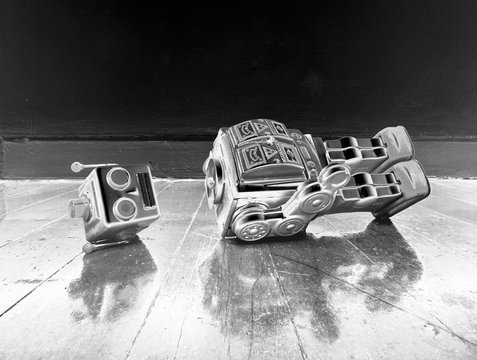 vintage bot lost his head on a old wooden floor