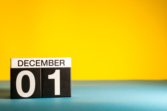 December 1st. Image 1 day of december month, calendar on yellow background. Winter background with empty space for text, mockup