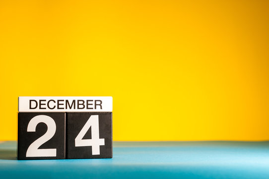 Eve. December 24th. Image 24 day of december month, calendar at yellow background. Christmas and new year celebration. Mockup