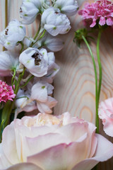 young flowers on rustic wooden boards background