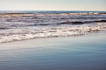 beach sand and waves gliding