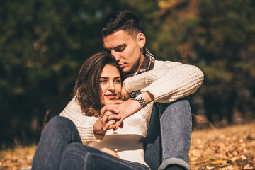 Classy couple kissing and hugging in the park