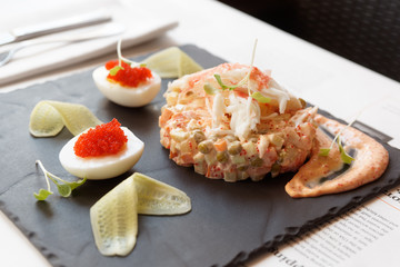 Russian salad with crab meat