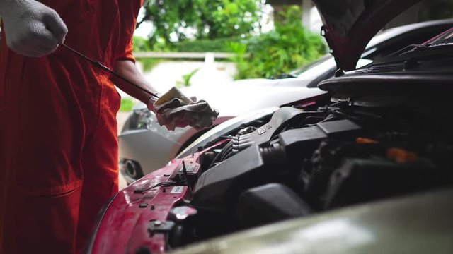 Technicians are working by doing a preliminary inspection of wheel system footage 4K