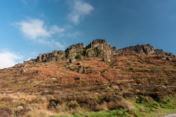 Fototapeta na wymiar Hen Cloud against a beautiful blue sky at the Roaches, Staffordshire in the Peak District National park.