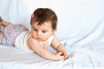 Obraz na płótnie Canvas beautiful baby girl with hair clipper on white background