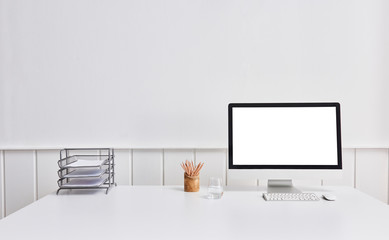 working table close up desktop screen folder and pencil white background.