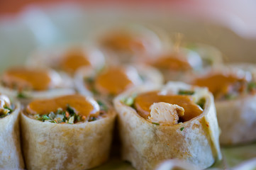 Vegetarian rolls and peanut sauce on top.