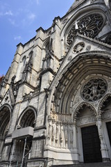 Fototapeta na wymiar The enormous exterior of St. John The Divine Cathedral in New York City