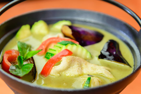 Traditional Thai close up chicken green curry.
