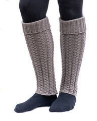 Young woman wearing cable knit leg warmers taupe color isolated on white background