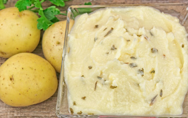 Mashed potatoes on wooden table