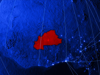 Burkina Faso on blue digital map with networks. Concept of international travel, communication and technology.
