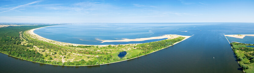 Widefield panoramic aerial view of beach by the blue Baltic sea and Vistula river mouth - obrazy, fototapety, plakaty