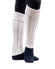 Young woman wearing cable knit leg warmers ivory color isolated on white background