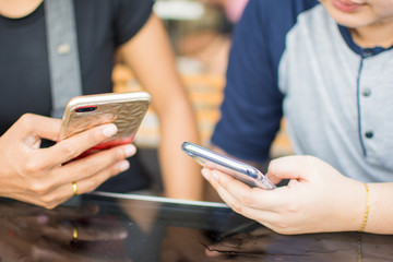 people holding smartphone and use. soft focus.