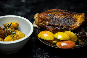 roast duck with sour apples and baked potatoes