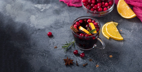 Mulled wine with cranberberries, christmas drink copy space background