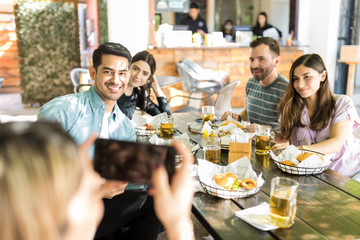 Men And Women Smiling For A Photograph