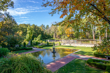 Fototapeta na wymiar beautiful elegant and upscale park or estate with statue in pond