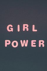 GIRL POWER writing on black paper background