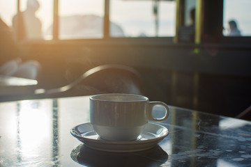 coffee cup at morning with sunlight. soft focus.