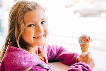 Fototapeta na wymiar Smiling Girl With Ice Cream Cone
