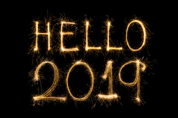 Happy new year 2018 text written with Sparkle fireworks isolated on black background