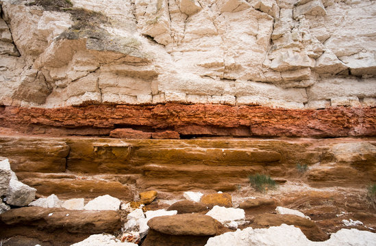 Sedimentary layers in a cliff face - Powered by Adobe