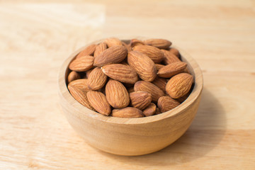 almond on wooden table. soft focus.
