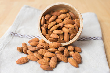 almond on wooden table. soft focus.