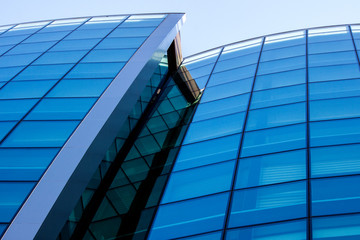 Modern straight and curved architectural lines of the facade of a building - photography