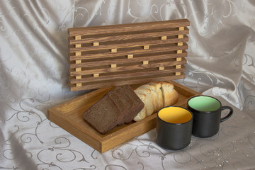 Fototapeta na wymiar wooden desk cups bread