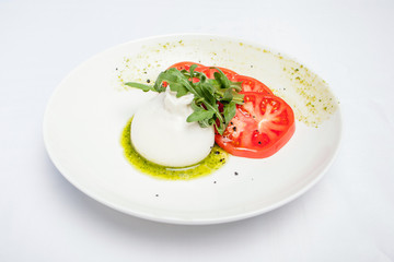 Buratta dish on a white background